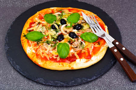 Pizza with Mushroom, Cheese, Mozzarella, Olives and Basil Studio Photoの写真素材