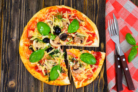 Pizza with Mushroom, Cheese, Mozzarella, Olives and Basil Studio Photoの写真素材