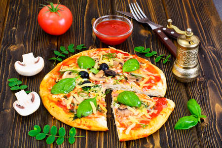 Pizza with Mushroom, Cheese, Mozzarella, Olives and Basil Studio Photoの写真素材