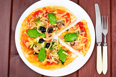 Pizza with Mushroom, Cheese, Mozzarella, Olives and Basil Studio Photoの写真素材
