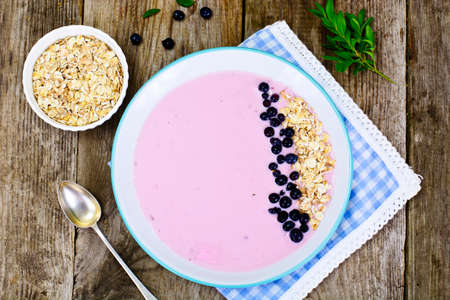 Smoothie with Blueberries, Oatmeal on Brown Boards Studio Photoの写真素材