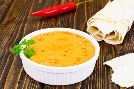 Hummus with Curry, Turmeric, Raw Chickpeas on the Boards Studio Photoの写真素材