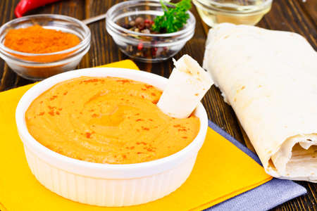 Hummus with Curry, Turmeric, Raw Chickpeas on the Boards Studio Photoの写真素材