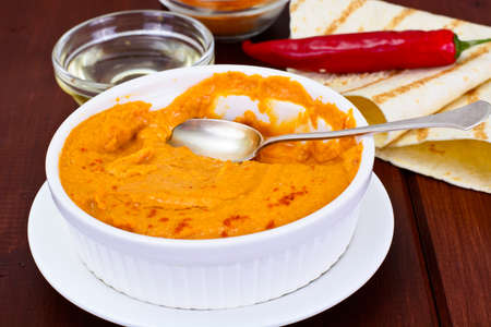 Hummus with Curry, Turmeric, Raw Chickpeas on the Boards Studio Photoの写真素材