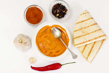 Hummus with Curry, Turmeric, Raw Chickpeas on the White Background Studio Photoの写真素材