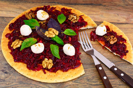 Pizza with Beet, Nut, Cheese, Mozzarella and Basil Studio Photoの写真素材