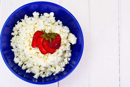 Home Dietary Fat Cottage Cheese Beaded Curd with Strawberry Studio Photoの写真素材
