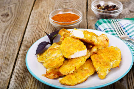 Breaded Chicken Fillet with Herbs. Studio Photo.の写真素材