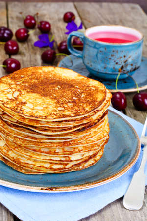 Tasty Pancakes Stack with Honey and Cherry Studio Photoの写真素材