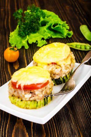 Zucchini with Tuna, Rice, Cheese and Tomato on Barbecue Grill Studio Photoの写真素材