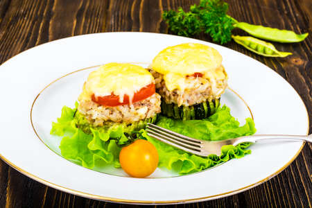 Zucchini with Tuna, Rice, Cheese and Tomato on Barbecue Grill Studio Photoの写真素材
