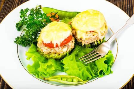 Zucchini with Tuna, Rice, Cheese and Tomato on Barbecue Grill Studio Photoの写真素材