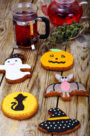 Gingerbread for Halloween with Red Tea. Funny Holiday Food for Children.Studio Photoの写真素材