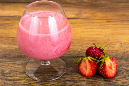 Strawberry Smoothie with Mint Leaves on White Backgroundの写真素材
