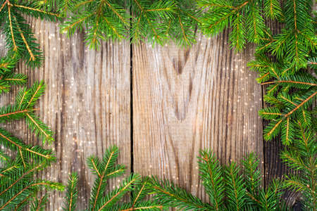 Abstract Christmas and New Year Background with Old Vintage Wooden Boards, Fir Branches and Glossy...