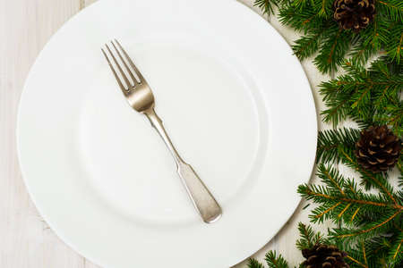 Abstract Christmas and New Year Background with Old Vintage Wooden Boards and White Empty Plate for Your Text, Fir Branches Studio Photoの写真素材