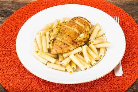 Grilled Chicken Fillet with Pasta Studio Photoの写真素材