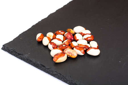 Dried White Beans on Dark Background. Studio Photo