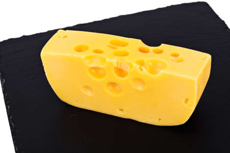 Swiss Cheese on Black Background Studio Photo