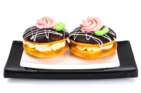 Colorful biscuits cakes  bush  with icing and custard filling. Studio Photo