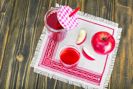 Apple juice from fresh ripe apples. Studio Photo