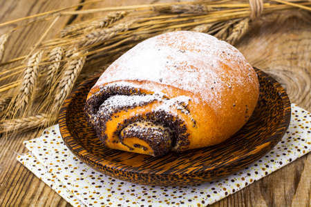 Buns with poppy seeds and icing sugar. Studio Photoの写真素材
