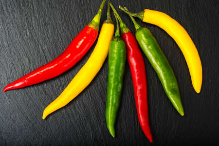 Chile on a black stone plate. Studio photoの写真素材