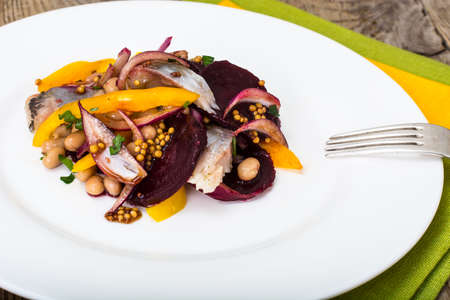 Salad with herring, beetroot, paprika, red onion, mustard and balsamic vinegar. Studio Photoの写真素材