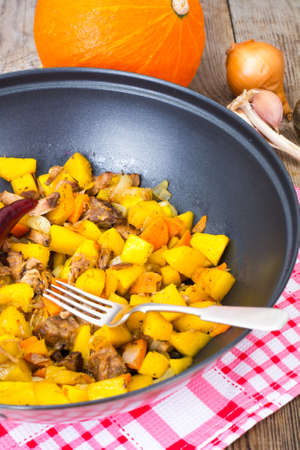 Stewed vegetables with meat in a frying pan. Studio Photoの写真素材
