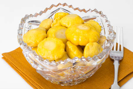 Small squash marinated in vintage crystal salad bowl. Studio Photoの写真素材