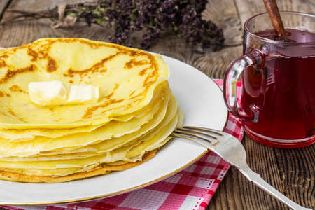 Pancakes and fruit tea with cinnamon