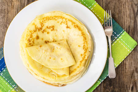 Thin pancakes with butter
