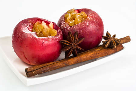Baked apple with raisins on a white backgroundの写真素材