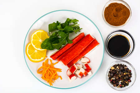 Crab sticks, lemon and arugulaの写真素材