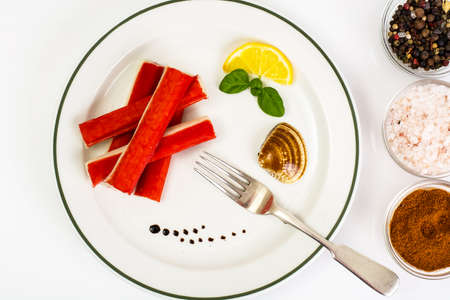 Crab sticks, lemon and arugulaの写真素材