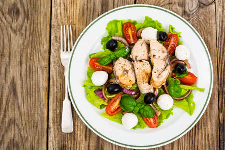 Fresh vegetables, tuna, olives and mozzarellaの写真素材