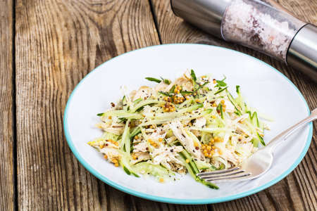 Salad with cucumber, chicken and mustardの写真素材