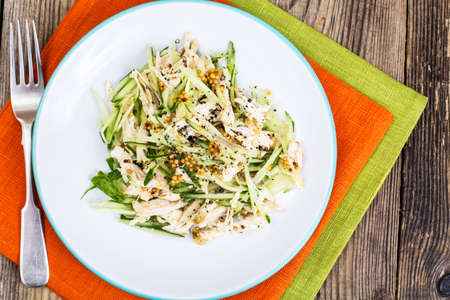 Salad with cucumber, chicken and mustardの写真素材