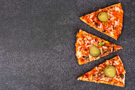 Pizza with cornichons view from above on a gray ston. Studio Photoの写真素材