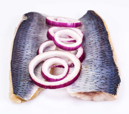 Fillet of salted herring with red onion ringsの写真素材