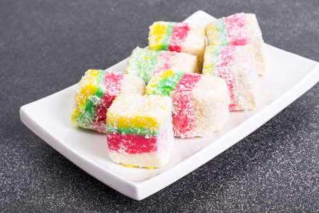 Eastern sweets Turkish delight in color coconut chipsの写真素材