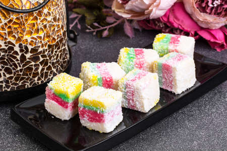 Eastern sweets Turkish delight in color coconut chipsの写真素材