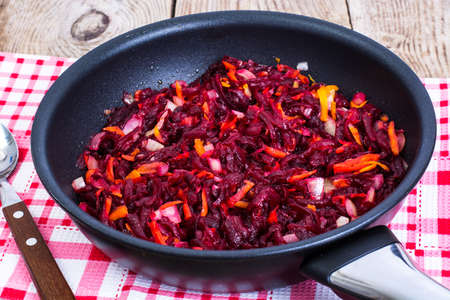 Beets, carrots, onions stewed with spicesの写真素材
