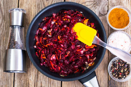 Beets, carrots, onions stewed with spicesの写真素材