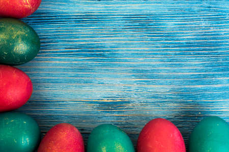 Abstraction painted Easter eggs on a blue background