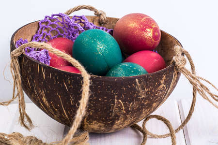 Easter, color painted eggs on white boardsの写真素材