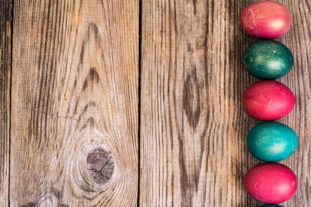 Easter eggs blessed on old wooden boardsの写真素材