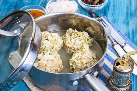 Meatballs with rice in brothの写真素材