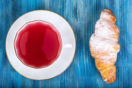 Croissant with kissel on blue backgroundの写真素材