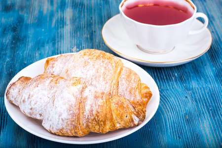 Croissant with kissel on blue backgroundの写真素材